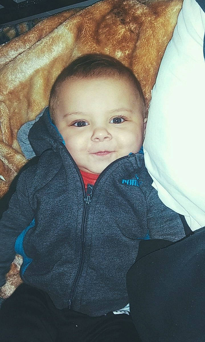 Lake is registered to the contest to win money with this photo: baby, cheek, child, chin, eye, face, forehead, fun, head, iris, lip, nose, outerwear, people, person, sitting, skin, sky, smile, toddler