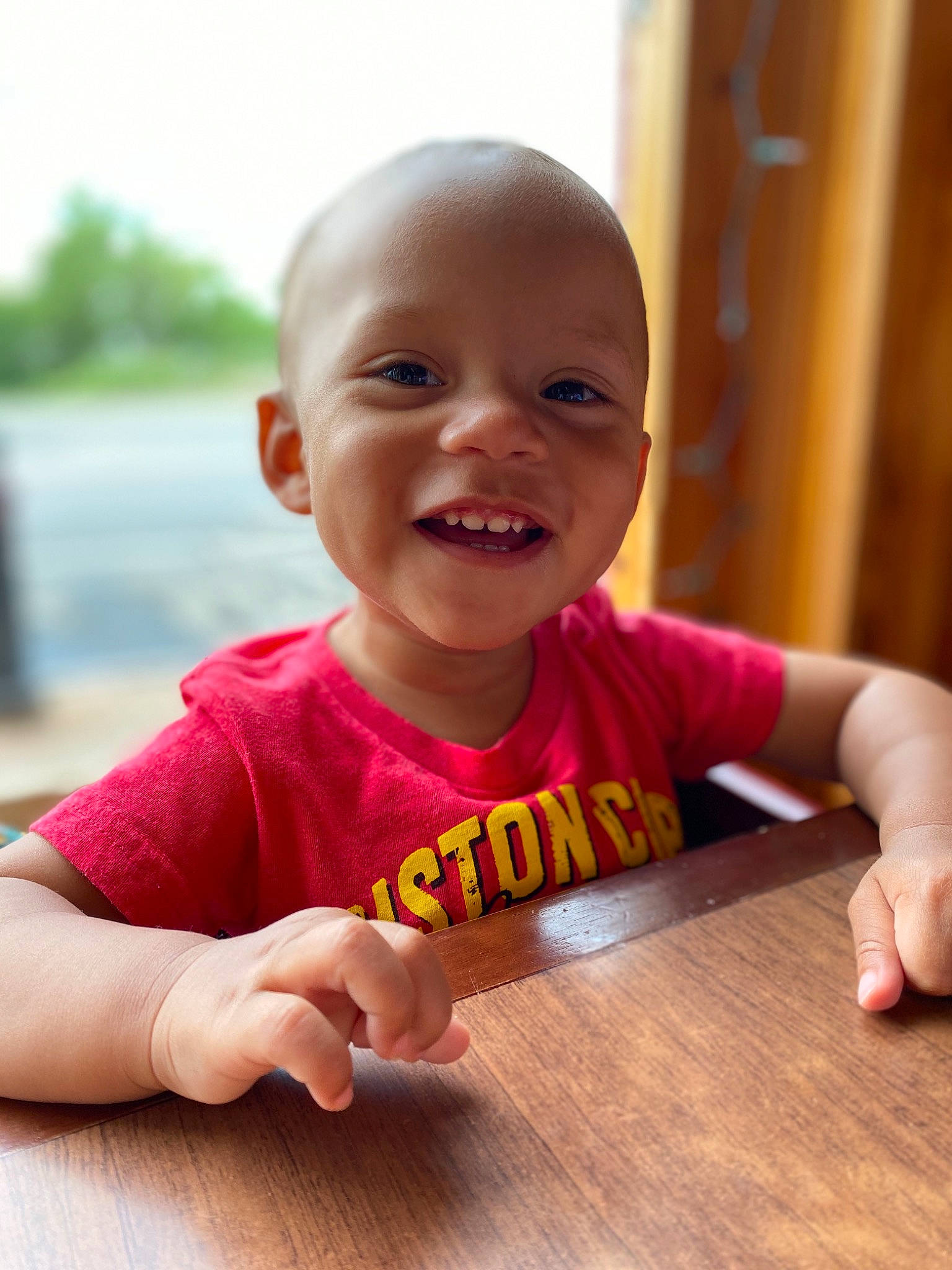 Joseph is registered to the contest to win money with this photo: baby, child, crawling, facial_expression, finger, floor, fun, hand, happy, joy, person, play, sitting, skin, smile, toddler, tummy_time, wood