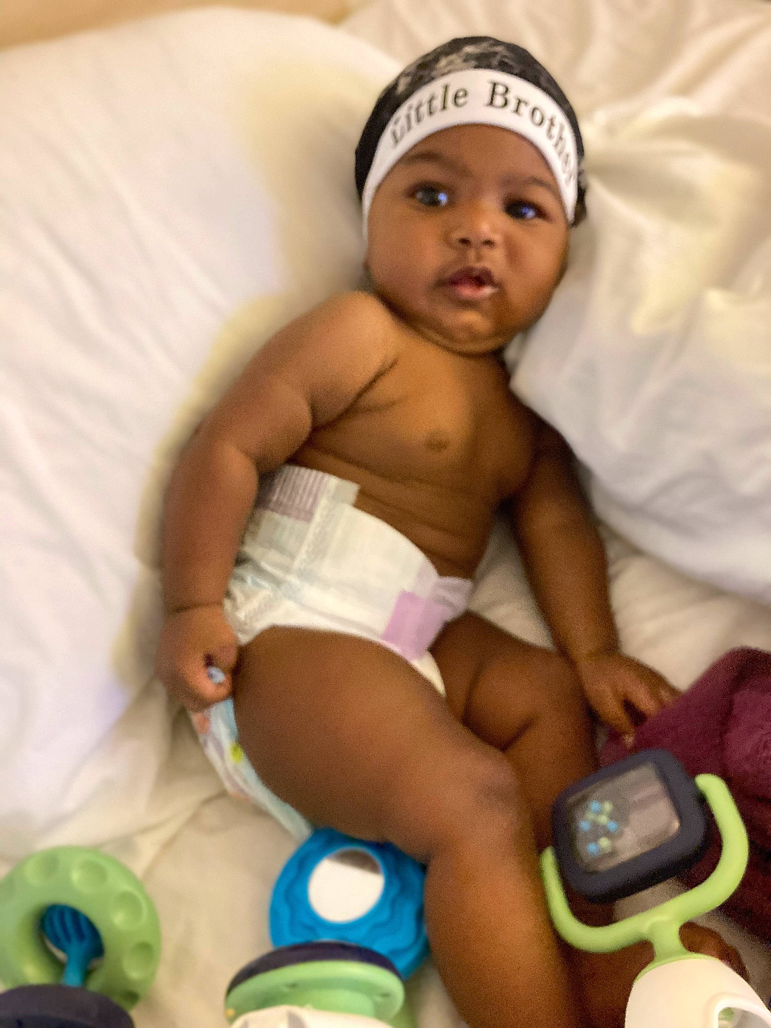 Michael is registered to the contest to win money with this photo: abdomen, baby, baby_safety, baby_toddler_clothing, cap, chest, child, comfort, diaper, finger, foot, headwear, human_leg, knee, person, room, skin, stomach, thigh, thumb