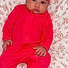 Kylie joined the competition — help win amazing prizes! baby, infant, child, portrait, lying_down, pink_outfit, onesie, headband, bow, floral_blanket, blanket, indoor, close_up, face, eyes, hands, feet, adorable, baby_fashion, photography
