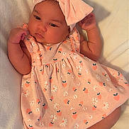 Kylie is registered to the contest to win money with this photo: baby, baby_photography, blanket, bow, child, cute, dress, eyes_open, face, fashion, floral_dress, flower_shoes, headband, indoor, infant, lying_down, pink, portrait, shoes, white_blanket