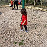 Ishamel Orta is registered to the contest to win money with this photo: adult, black_pants, bucket, child, childhood, daylight, drink, family, fence, outdoor, park, pebbles, play_area, playground, portrait, red_shirt, sneakers, toddler, trees, walking