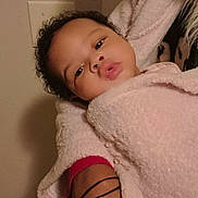 Aiva is registered to the contest to win money with this photo: accessories, baby, blanket, bodypart, earring, face, fashion, finger, happy, head, indoors, jewelry, newborn, person, photography, portrait, quilt, sleeping, smile, towel