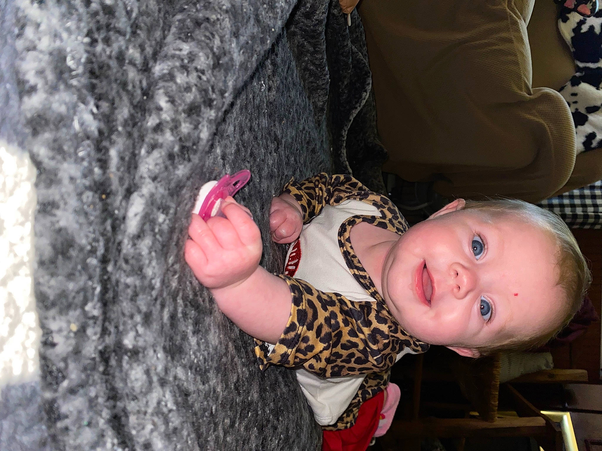 Jazlyn is registered to the contest to win money with this photo: arm, baby, baby_toddler_clothing, finger, fun, gesture, hand, happy, joint, lip, nail, nose, pattern, person, pink, skin, toddler, tree, trunk, wood