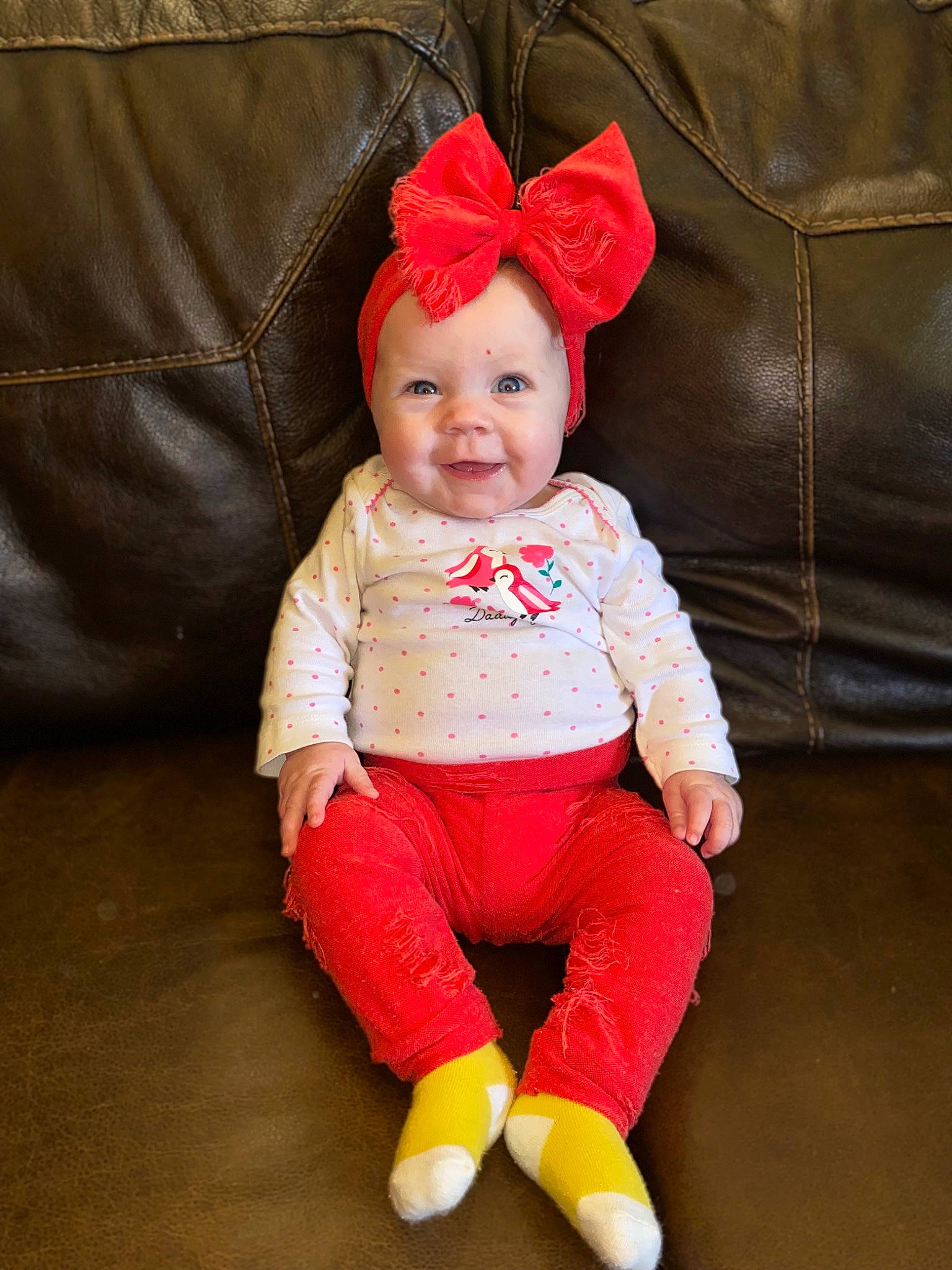 Jazlyn joined the competition — help win amazing prizes! baby, baby_toddler_clothing, cheek, comfort, costume_hat, face, fashion_accessory, happy, head, headgear, human_body, magenta, orange, outerwear, person, red, sleeve, smile, textile, toddler