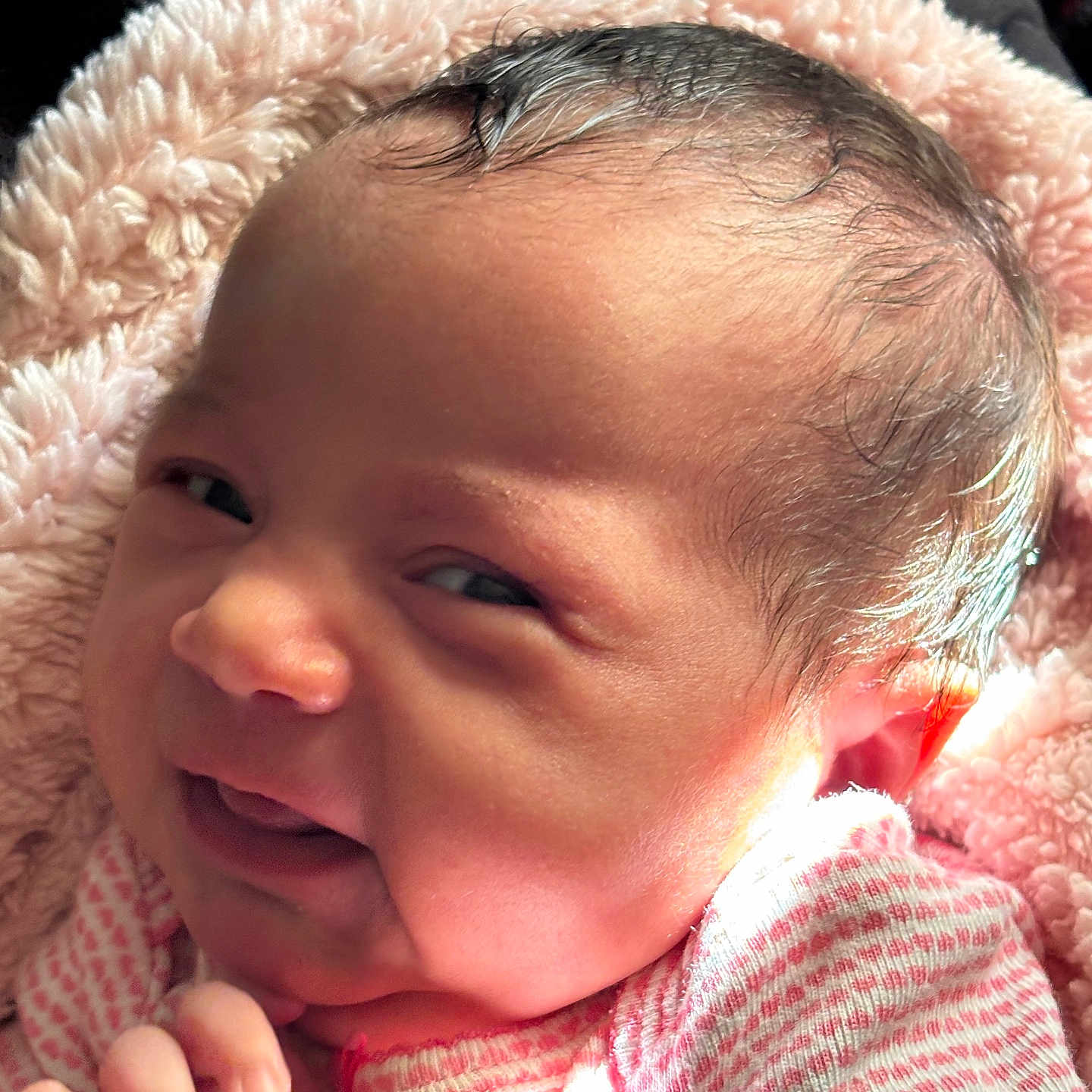 Reyah joined the competition — help win amazing prizes! baby, blanket, child, closeup, clothing, cute, expression, face, hair, hand, indoors, infant, light, newborn, person, pink, portrait, skin, smile, soft