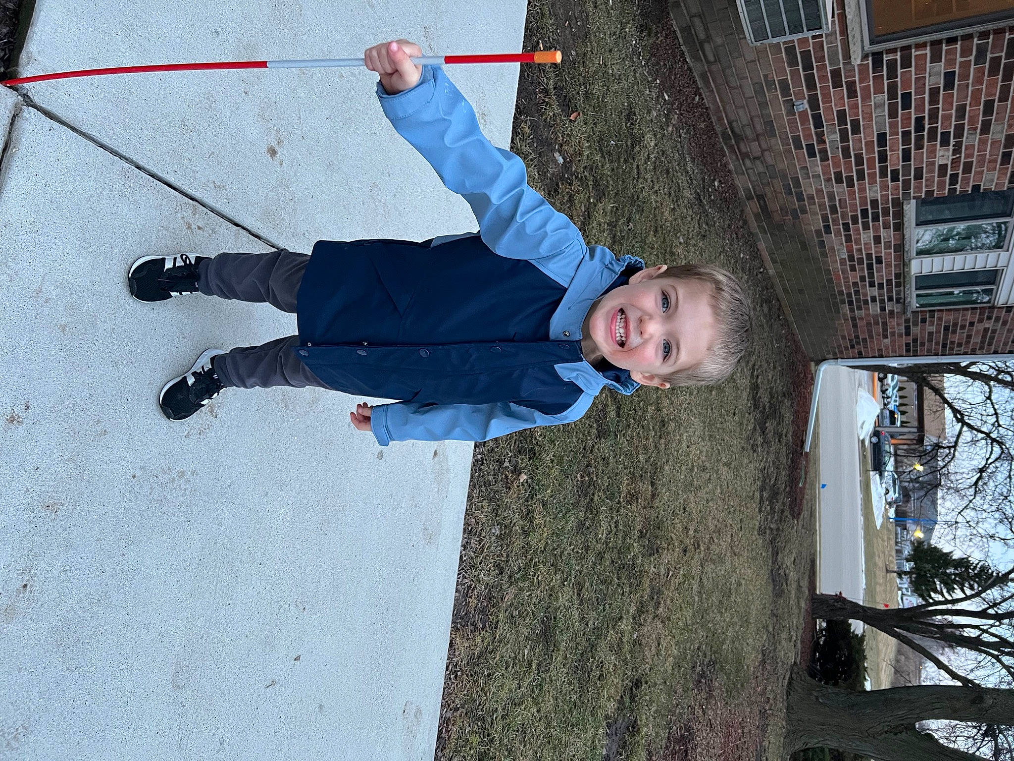 Carson is registered to the contest to win money with this photo: adventure, child, city, composite_material, concrete, electric_blue, flooring, fun, happy, joy, leisure, outdoor_shoe, person, plant, recreation, rope, smile, toddler, tree, trunk