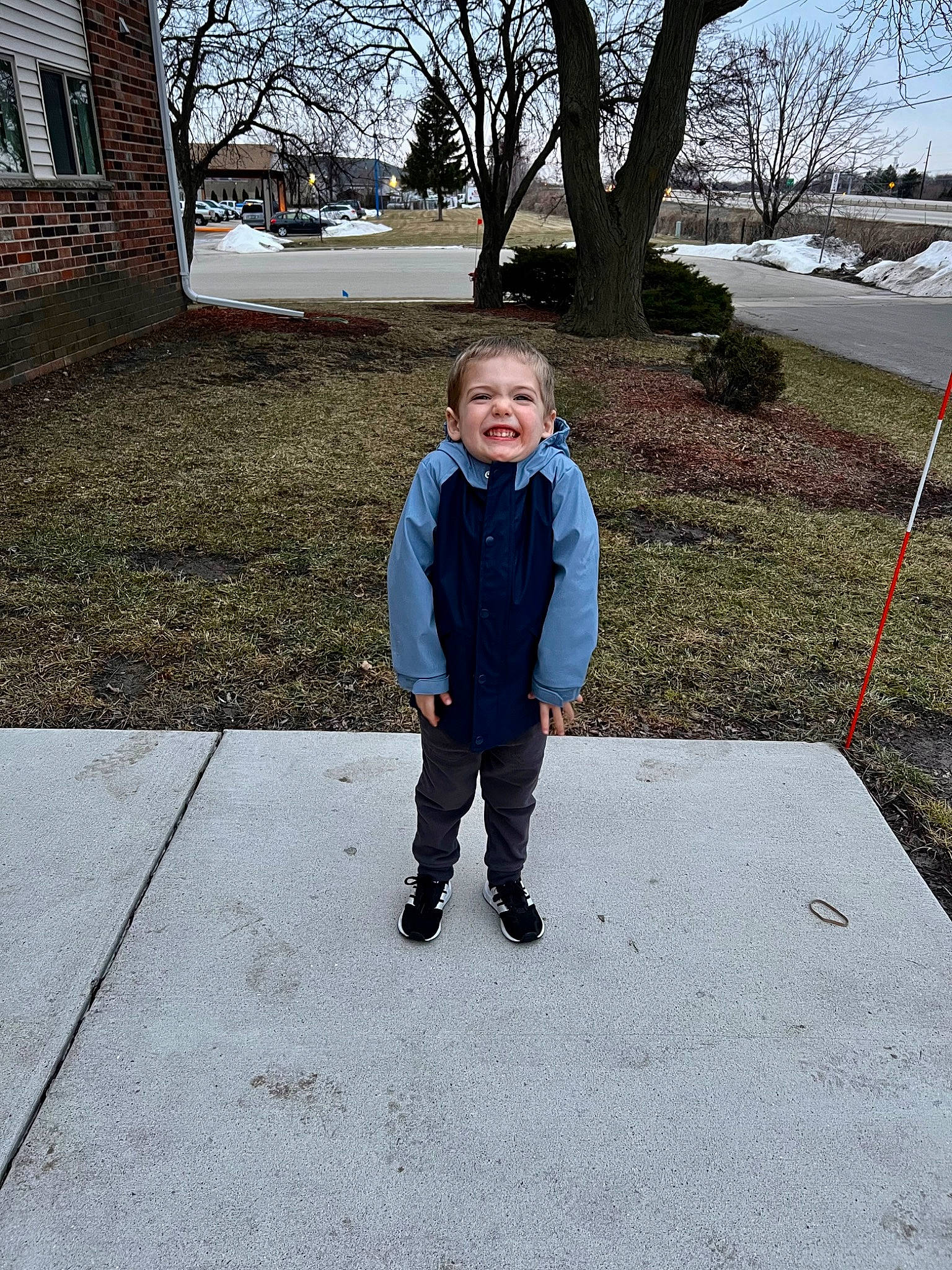 Carson joined the competition — help win amazing prizes! asphalt, concrete, denim, electric_blue, fun, grass, leisure, people_in_nature, person, plant, public_space, recreation, road_surface, sidewalk, sky, smile, toddler, tree, walkway, window