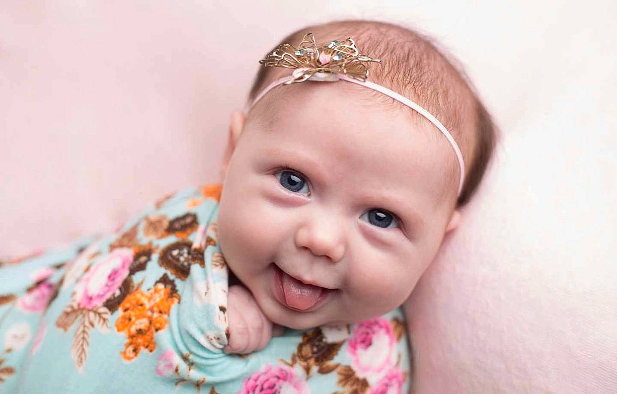 Pheonix Jade Harvey is registered to the contest to win money with this photo: baby, cheek, child, eyebrow, face, facial_expression, fashion_accessory, forehead, hair, hair_accessory, head, headband, headgear, headpiece, lip, nose, person, pink, skin, smile