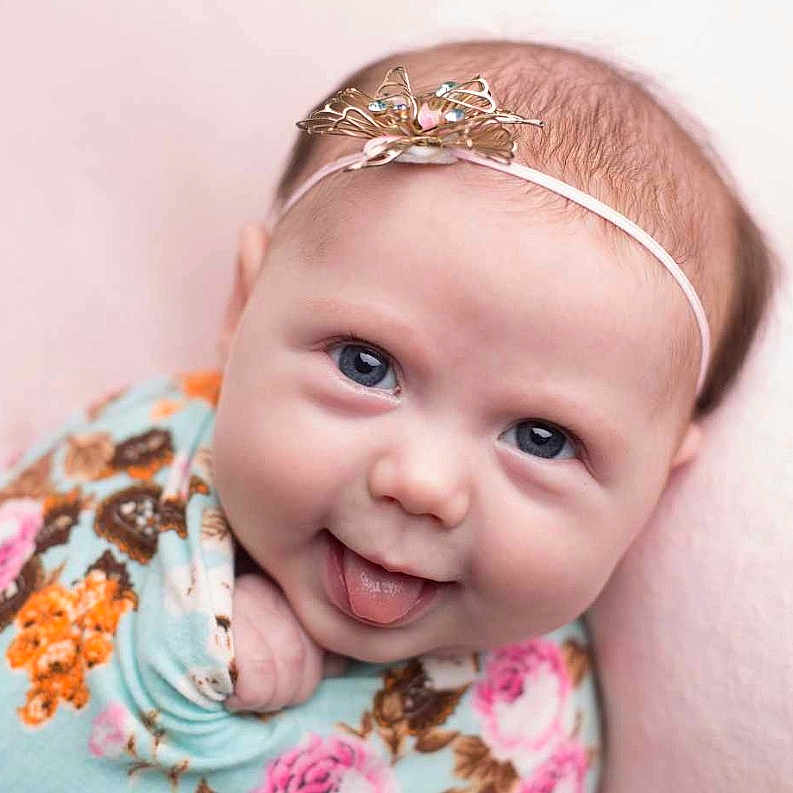 Pheonix Jade Harvey is registered to the contest to win money with this photo: baby, cheek, child, eyebrow, face, facial_expression, fashion_accessory, forehead, hair, hair_accessory, head, headband, headgear, headpiece, lip, nose, person, pink, skin, smile