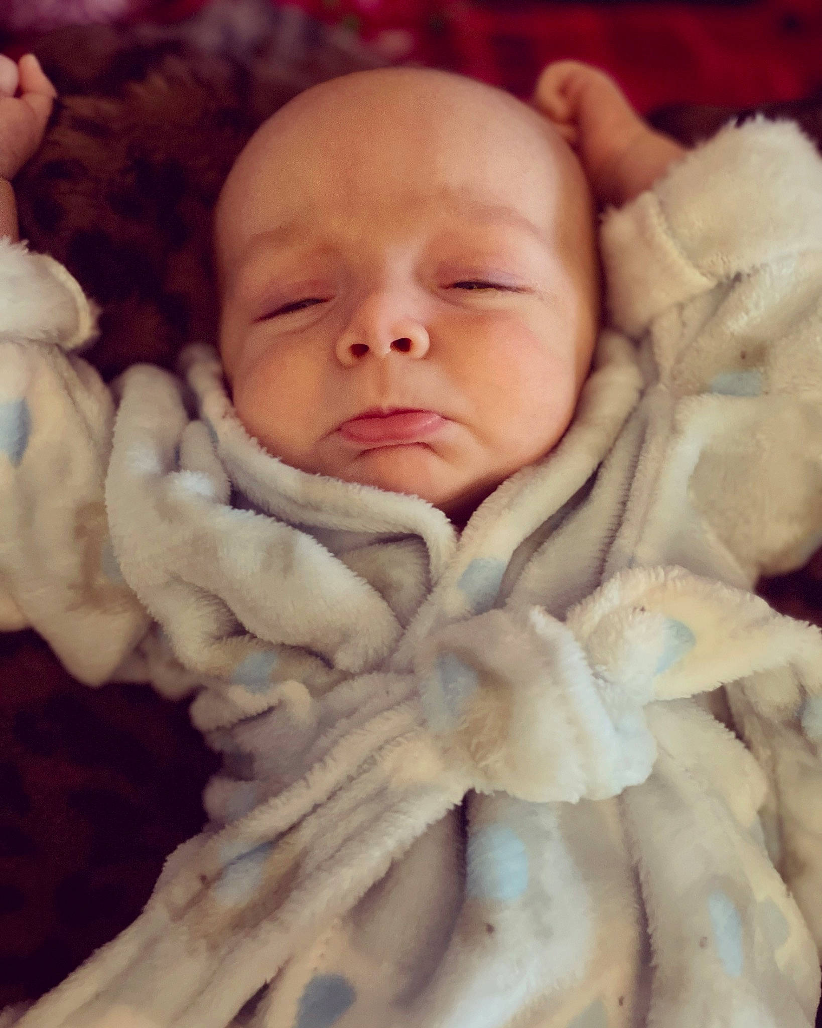 Hagen is registered to the contest to win money with this photo: baby, baby_sleeping, cheek, child, chin, close_up, comfort, fur, happy, linens, pattern, peach, person, scarf, shawl, skin, stole, textile, thumb, toddler