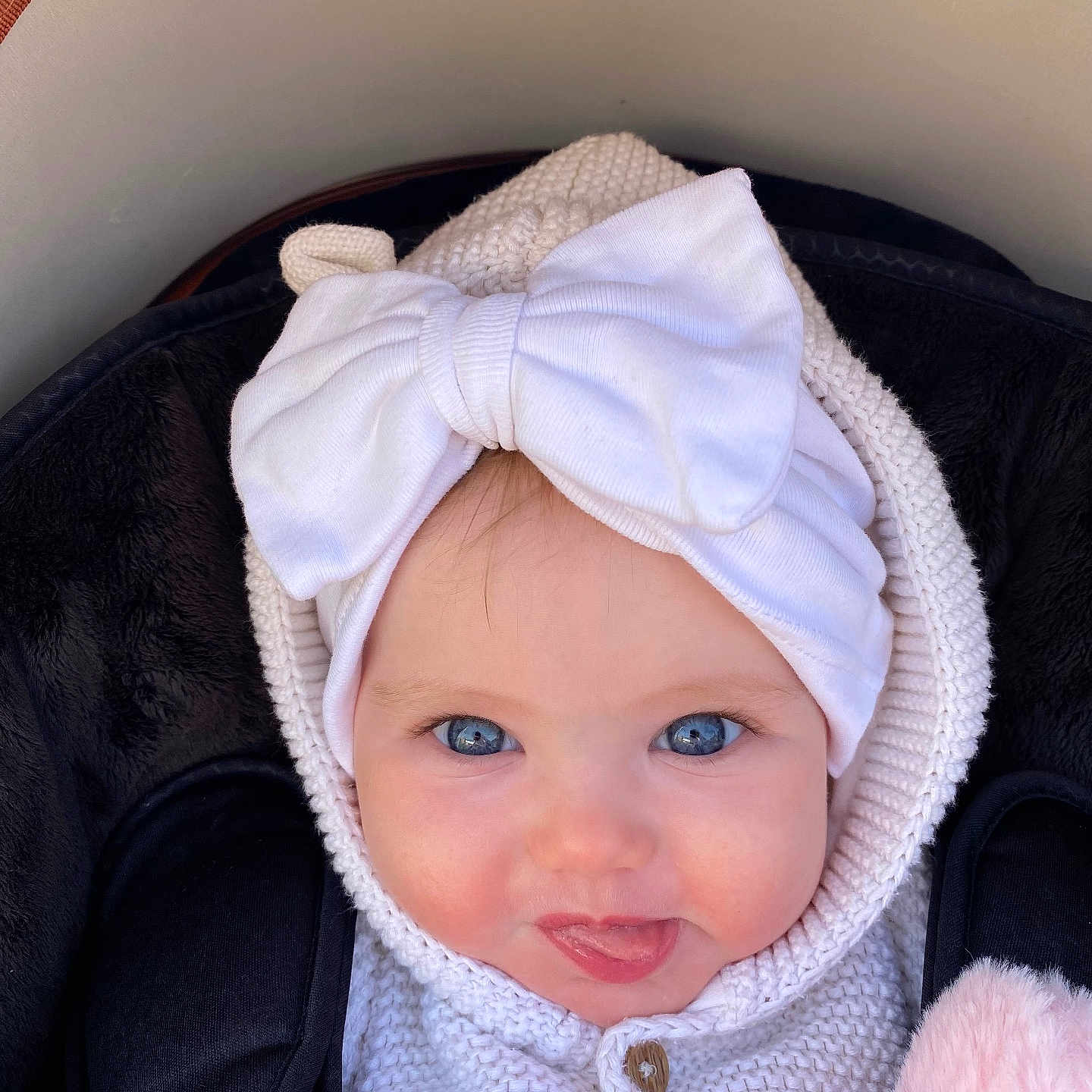 Alleria is registered to the contest to win money with this photo: baby, bonnet, cap, clothing, coat, face, happy, hat, head, hood, hoodie, jacket, knitwear, newborn, person, photography, portrait, smile, sweater, sweatshirt