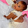 accessories, baby, bodypart, bonnet, clothing, dress, eveningdress, face, fashion, finger, formalwear, gown, hand, hat, head, newborn, person, photography, portrait, toy