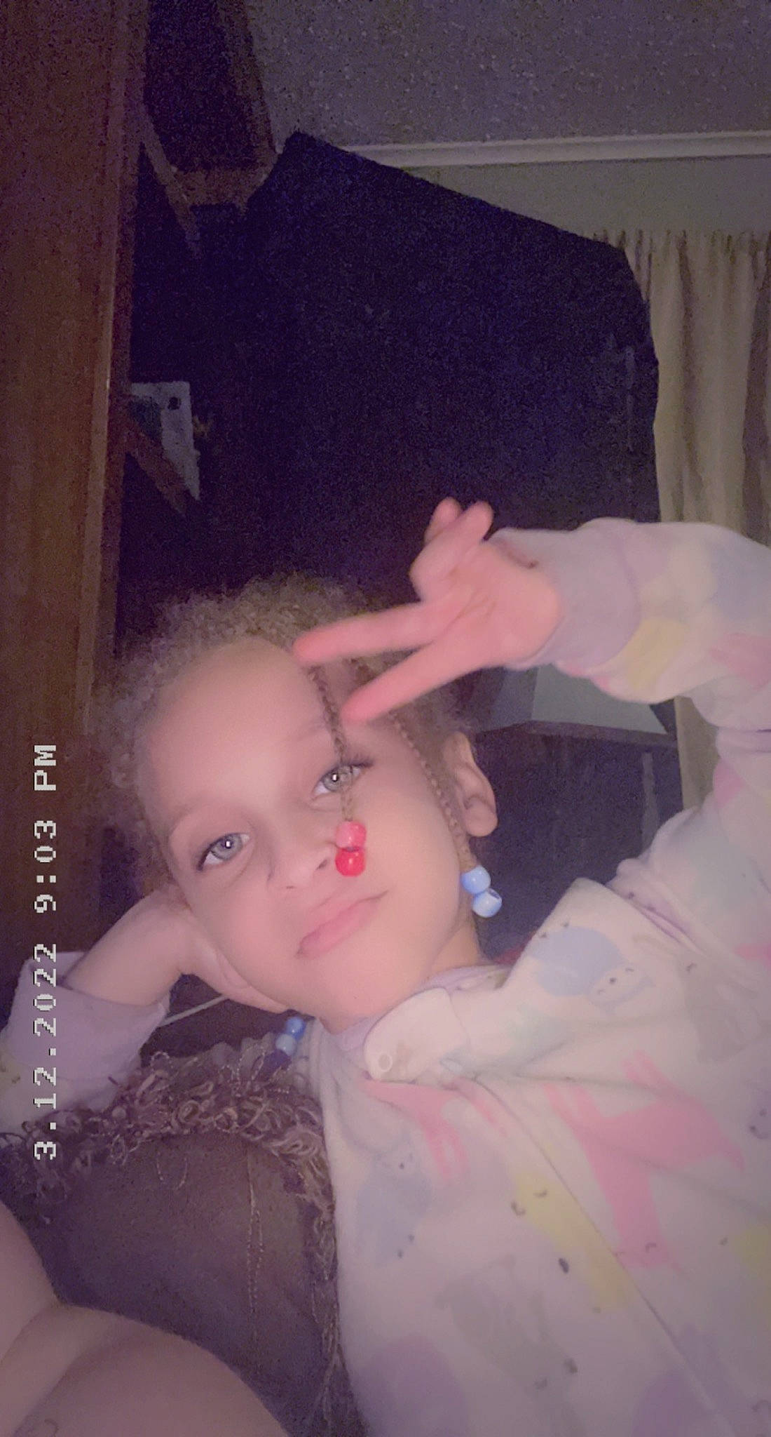 Noriah is registered to the contest to win money with this photo: baby, cheek, chest, chin, ear, eyebrow, eyelash, flash_photography, gesture, iris, jaw, lip, mouth, nose, person, pink, skin, thumb, toddler, trunk