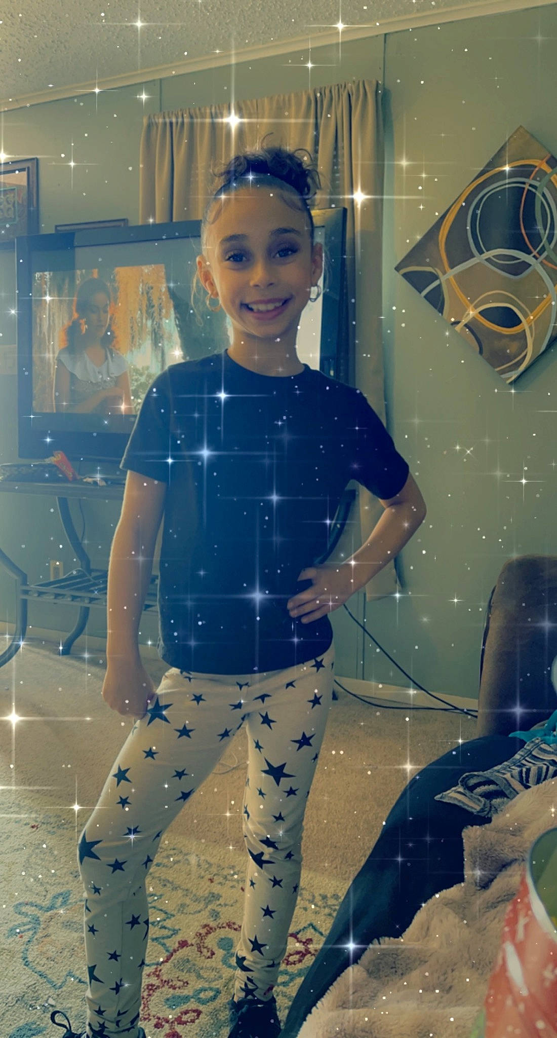 Zamyah is registered to the contest to win money with this photo: child, cool, electric_blue, eyewear, flooring, fun, happy, joy, leisure, party_supply, pattern, person, personal_protective_equipment, recreation, sleeve, smile, space, standing, t_shirt, thigh