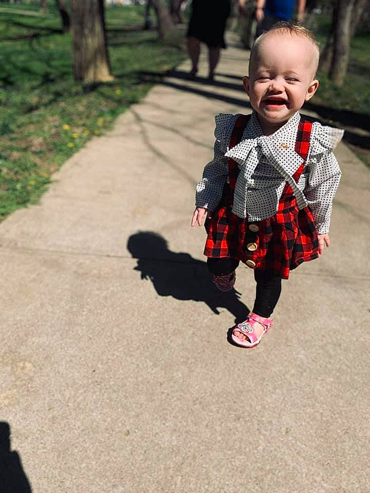 Amethyst is registered to the contest to win money with this photo: asphalt, baby, baby_toddler_clothing, child, dress, grass, happy, leaf, leisure, pattern, people_in_nature, person, plaid, plant, recreation, sleeve, smile, street_fashion, tartan, toddler