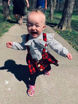 Amethyst is registered to the contest to win money with this photo: baby, baby_toddler_clothing, child, event, face, fun, grass, happy, head, leisure, pattern, people_in_nature, person, photograph, plaid, plant, recreation, sleeve, tartan, toddler