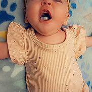 Kaleya joined the competition — help win amazing prizes! baby, infant, child, smiling, laughing, headband, clothing, peach, sparkle, blanket, paw_print, lying_down, cute, happy, face, mouth_open, skin, expression, small_person, adorable