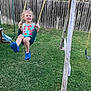 Kaleya joined the competition — help win amazing prizes! backyard, blue_shoes, casual, child, colorful_clothing, daytime, fence, flower_pattern, fun, grass, happy, outdoor, play, playground, smile, summer, sunlight, swing, wood, young_child