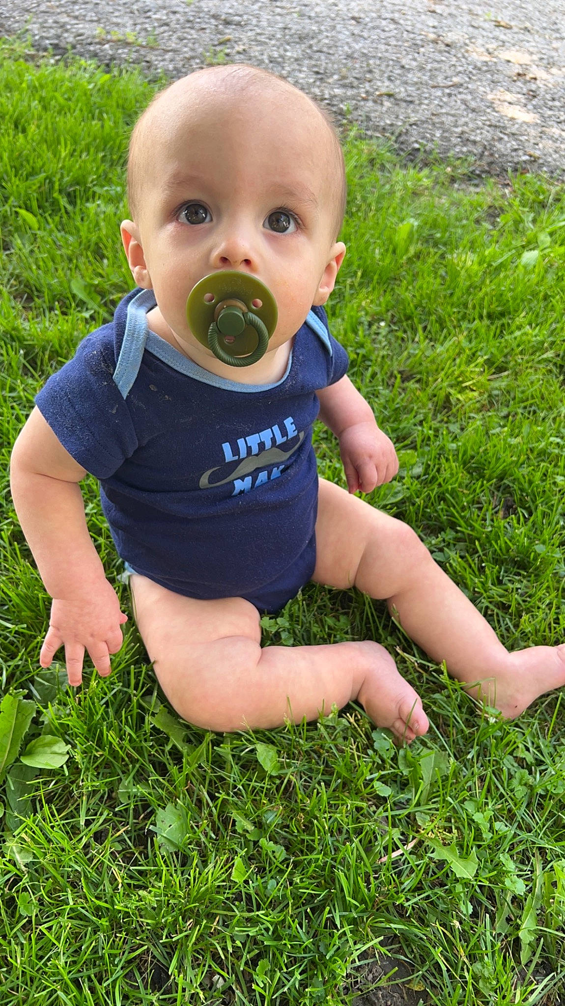 Waylon is registered to the contest to win money with this photo: baby, baby_toddler_clothing, child, finger, fun, grass, grass_family, grassland, groundcover, hand, happy, lawn, meadow, people_in_nature, person, photograph, plant, sitting, summer, thumb