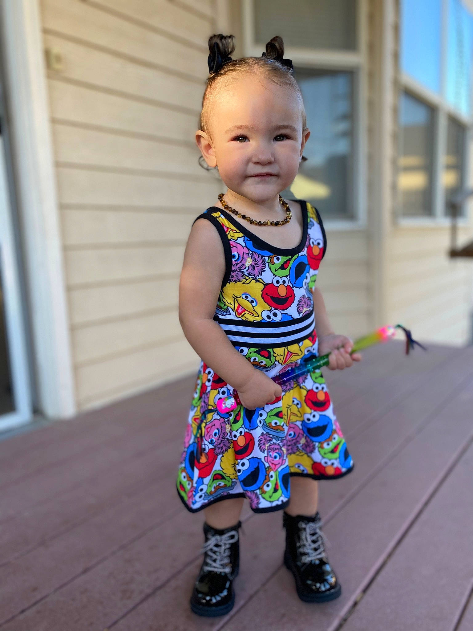 Izabella is registered to the contest to win money with this photo: baby, baby_toddler_clothing, child, day_dress, dress, electric_blue, facial_expression, fun, hairstyle, happy, magenta, pattern, person, pink, purple, sandal, sleeve, smile, toddler, vacation