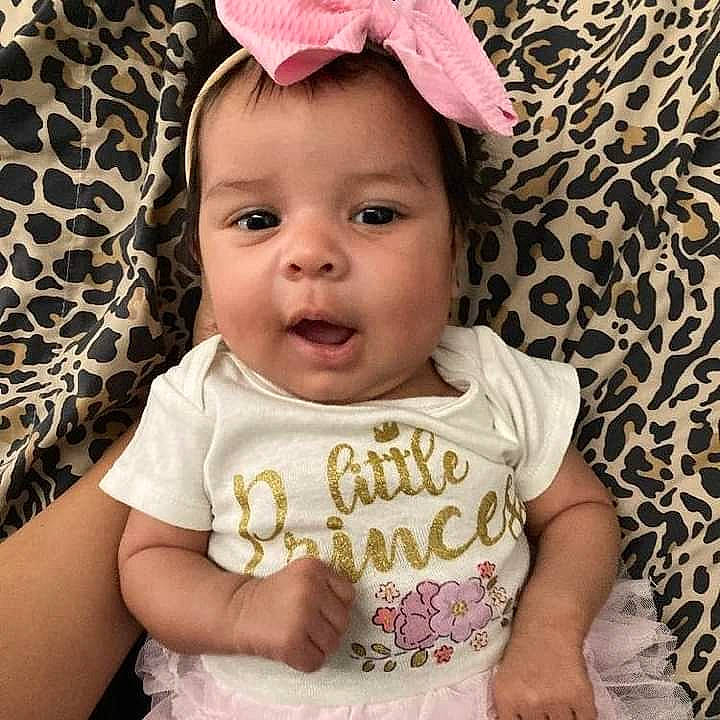 Malaysia is registered to the contest to win money with this photo: baby, baby_toddler_clothing, cap, cheek, child, cool, eyebrow, eyelash, facial_expression, happy, iris, lip, nose, pattern, person, pink, skin, sleeve, smile, t_shirt