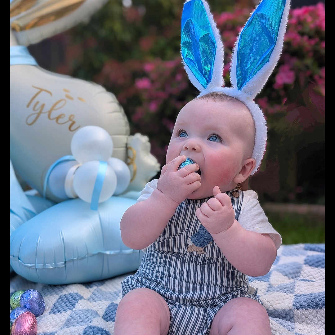 Tyler joined the competition — help win amazing prizes! baby, balloon, bodypart, bonnet, clothing, cream, dessert, face, finger, food, hand, hat, head, icing, inflatable, person, photography, portrait, sitting, sweets