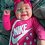 Mireyah joined the competition — help win amazing prizes! baby, infant, smile, pink, headband, bow, onesie, nike, clothing, happy, cheeks, face, cute, lying_down, blanket, fabric, soft, child, portrait, indoors