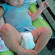 Emerson is registered to the contest to win money with this photo: baby, blanket, carpet, child, cushion, diaper, face, feet, hair, indoor, legs, mattress, messy_room, portrait, relaxed, shirt, sitting, stain, toddler, toes