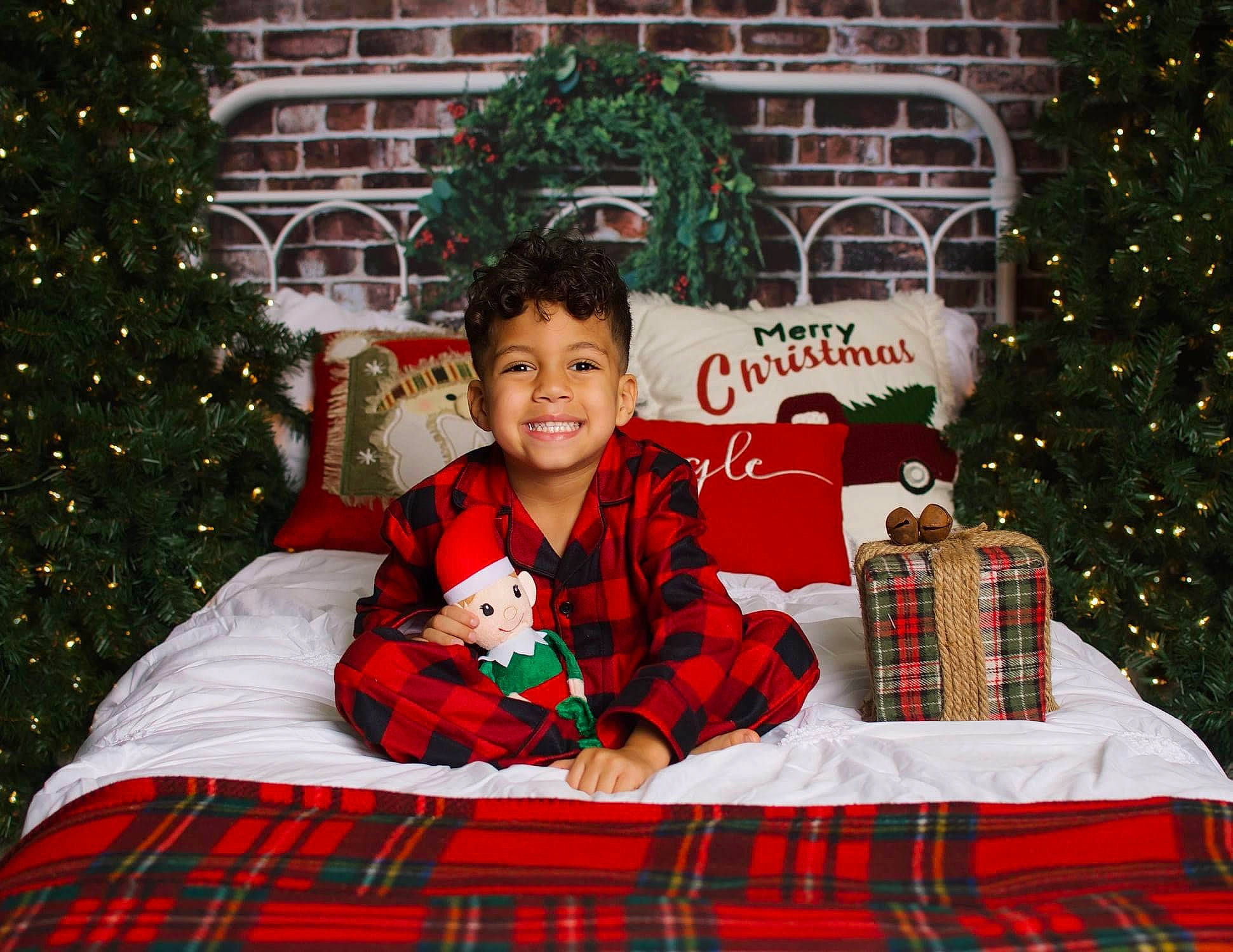 Kamdyn is registered to the contest to win money with this photo: carmine, christmas, christmas_decoration, christmas_eve, christmas_ornament, christmas_tree, evergreen, green, holiday, home_accessories, human, interior_design, joy, linens, pattern, person, plaid, red, tablecloth, tartan