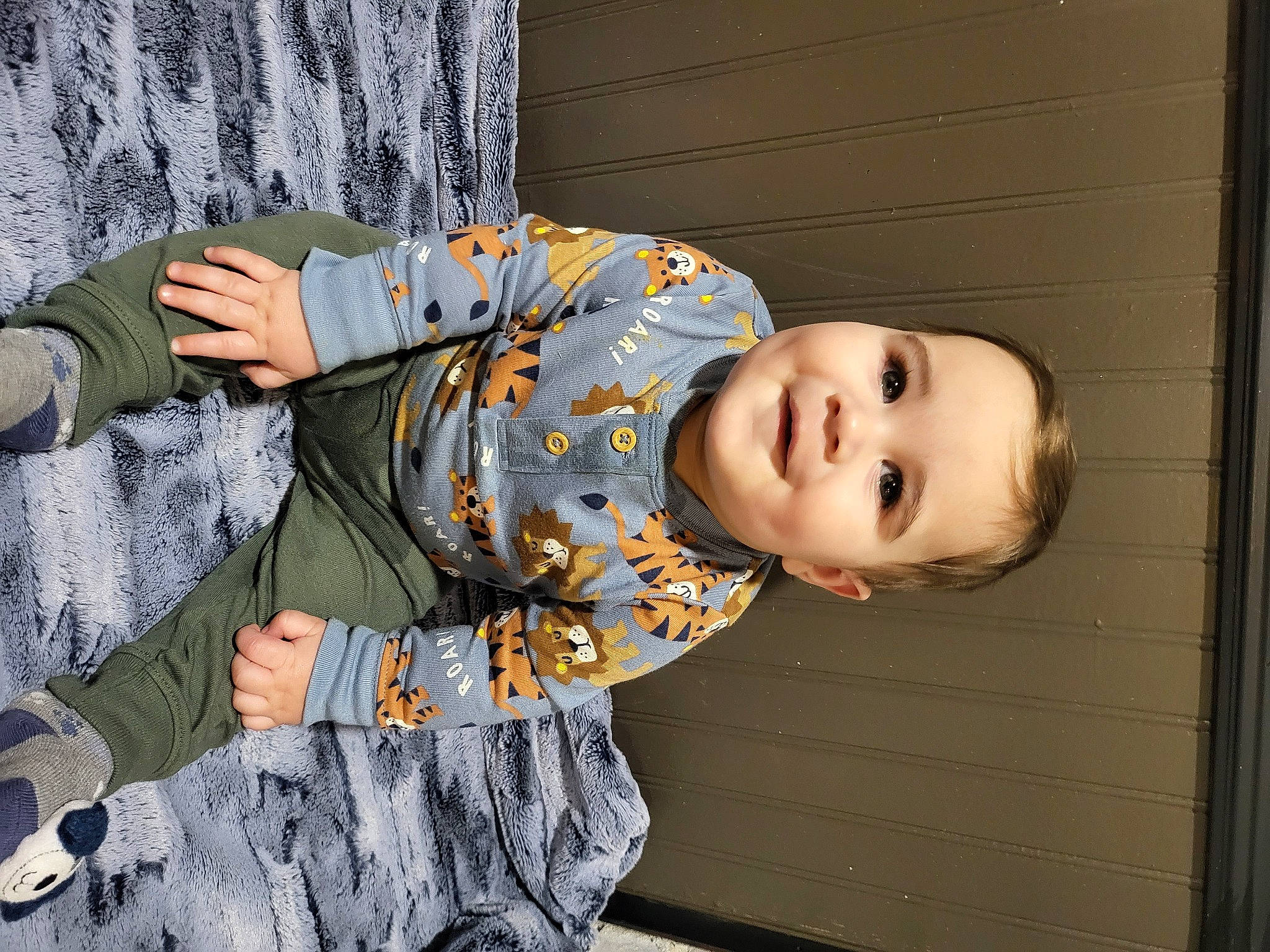 Luka is registered to the contest to win money with this photo: army, baby, baby_toddler_clothing, camouflage, child, denim, fun, gesture, hand, happy, joy, military_camouflage, military_person, military_uniform, pattern, person, sitting, sleeve, smile, textile
