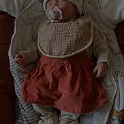 Apolline participe au concours pour gagner de l'argent avec cette photo : baby, sleeping, pacifier, hat, bib, dress, shoes, blanket, infant, cozy, bed, soft, child, resting, cute, warm, indoors, clothing, toddler, peaceful