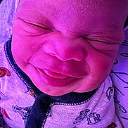 Amouri is registered to the contest to win money with this photo: baby, clothing, coat, crying, face, frown, glove, happy, head, hoodie, jacket, knitwear, newborn, person, photography, portrait, purple, sad, sweater, sweatshirt