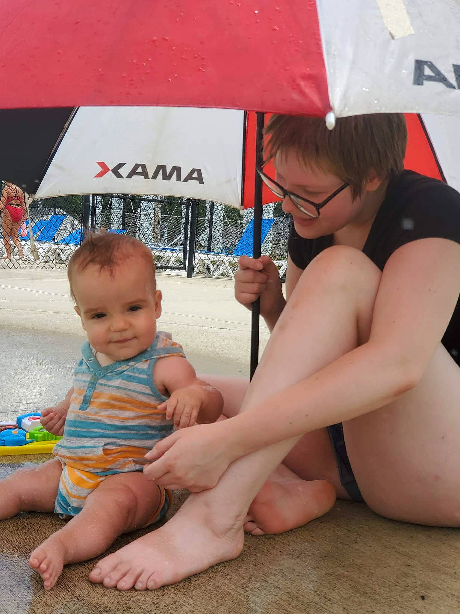 Maximus is registered to the contest to win money with this photo: baby, barefoot, chest, facial_expression, finger, foot, fun, glasses, happy, human, human_leg, joint, joy, knee, leisure, mouth, person, shorts, skin, thigh