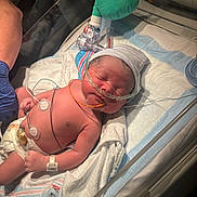 Kashton joined the competition — help win amazing prizes! baby, bed, blanket, care, closeup, diaper, gloved_hand, hat, healthcare, hospital, incubator, infant, medical, medical_equipment, monitoring_wires, newborn, nursery, patient, person, sleeping