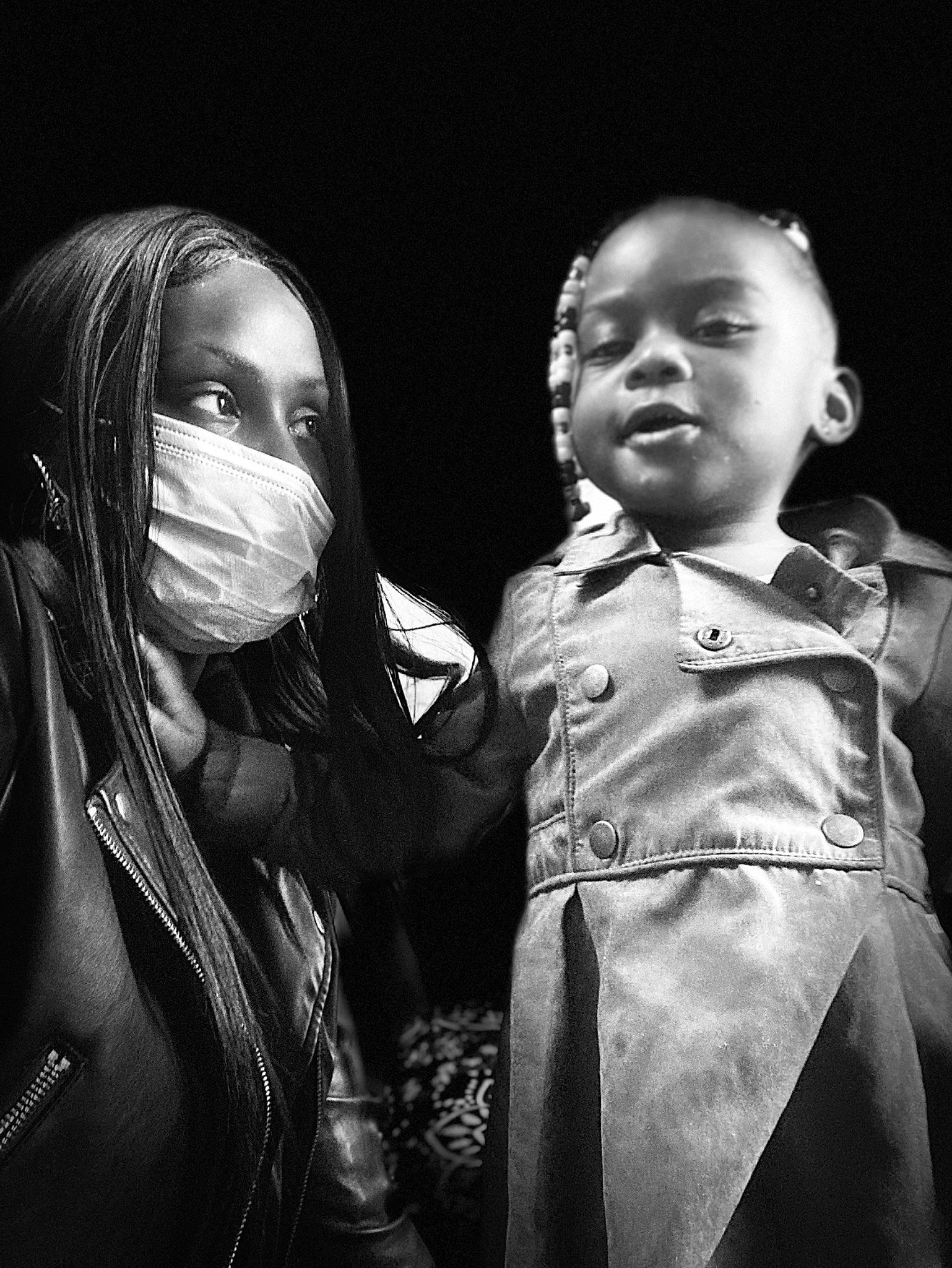 Christa is registered to the contest to win money with this photo: black_and_white, child, darkness, entertainment, event, fashion_design, flash_photography, formal_wear, fun, gesture, happy, jewellery, leather_jacket, monochrome, monochrome_photography, necklace, person, portrait, portrait_photography, style