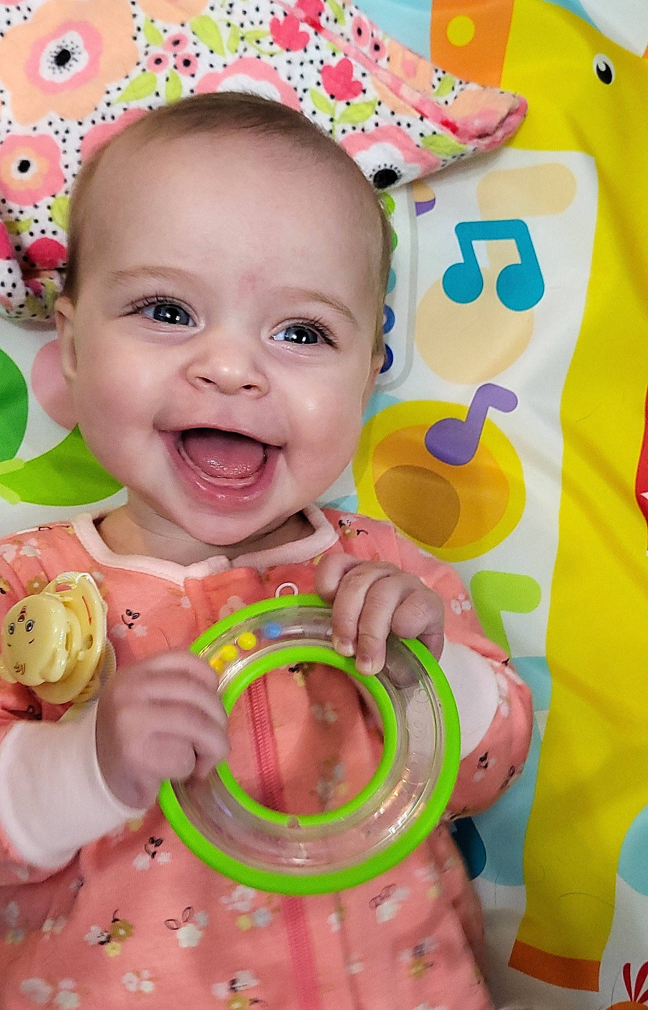 Leighton is registered to the contest to win money with this photo: baby, baby_toddler_clothing, cheek, chin, face, facial_expression, happy, human, mouth, nose, orange, person, pink, product, red, skin, smile, textile, toddler, white