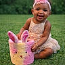 baby, child, toddler, smiling, happy, outdoor, grass, garden, portrait, dress, headband, flower, pink, plush_toy, bunny, basket, sitting, infant, earrings, spring