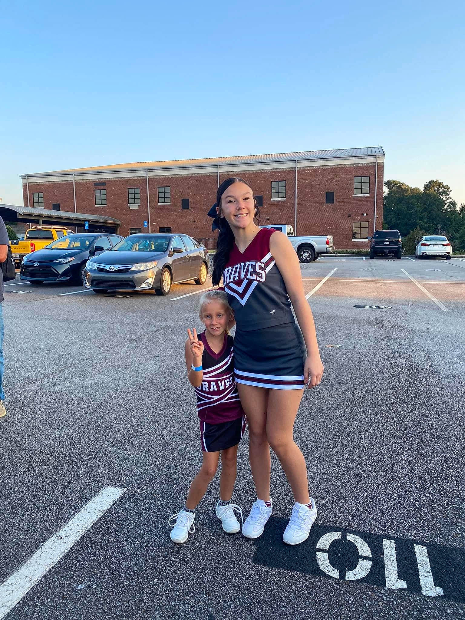 Brenley is registered to the contest to win money with this photo: asphalt, automotive_design, automotive_exterior, car, electric_blue, family_car, headwear, human_leg, joy, luxury_vehicle, motor_vehicle, parking, person, personal_luxury_car, road, shorts, sky, smile, t_shirt, thigh