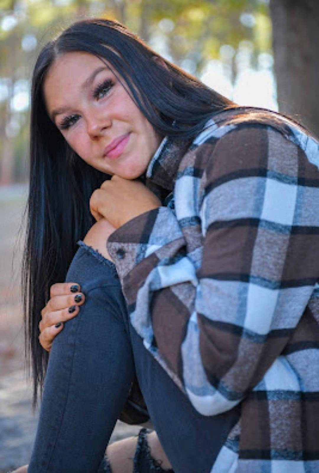 Haley joined the competition — help win amazing prizes! black_hair, cool, eye, flash_photography, grass, happy, head, human_leg, joy, layered_hair, lip, long_hair, outerwear, pattern, person, plaid, sleeve, smile, tartan, textile