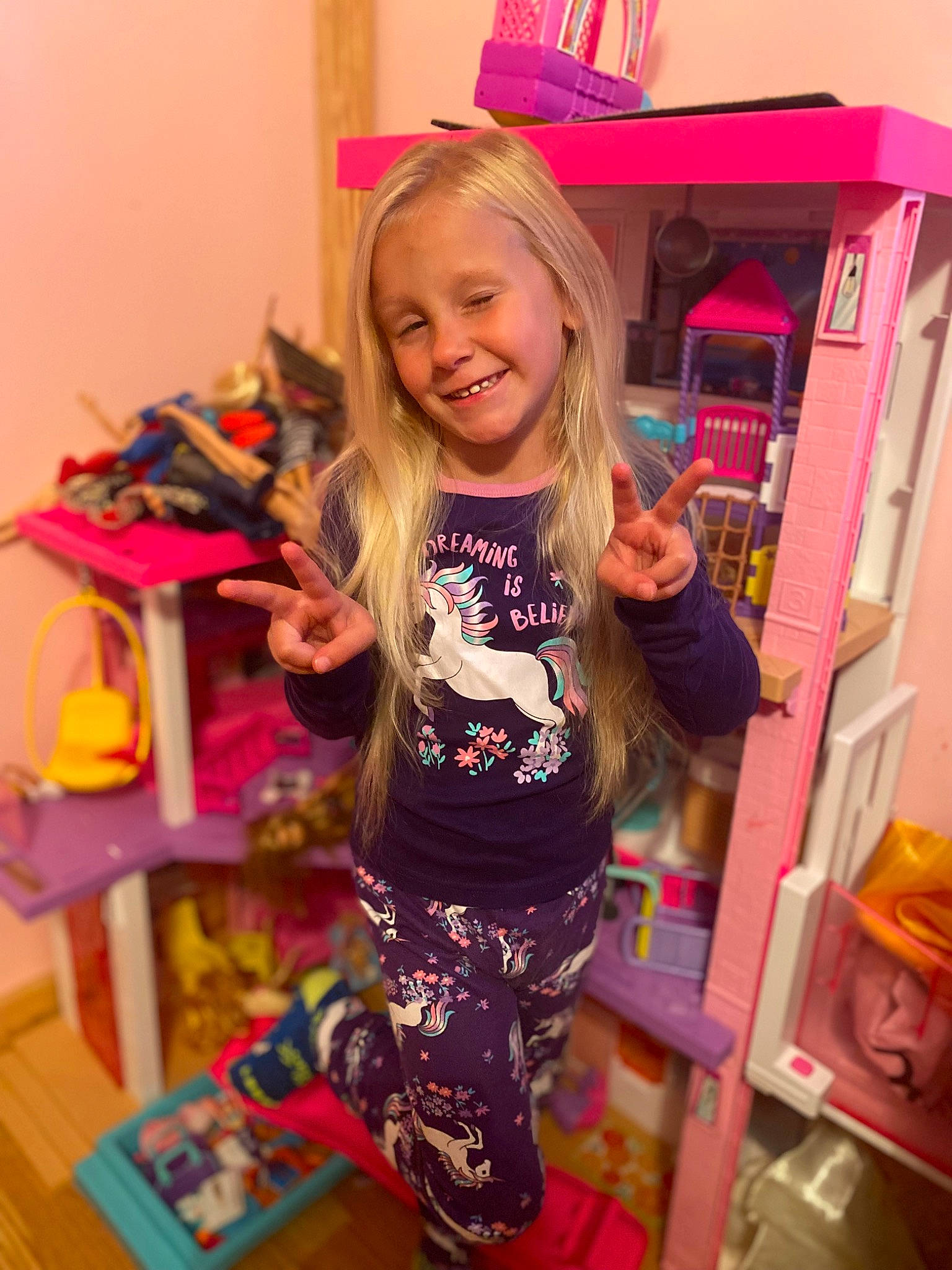 Brenley is registered to the contest to win money with this photo: blond, child, fashion_accessory, fun, happy, hat, joy, magenta, person, pink, play, product, purple, room, shelf, sleeve, smile, standing, t_shirt, thigh