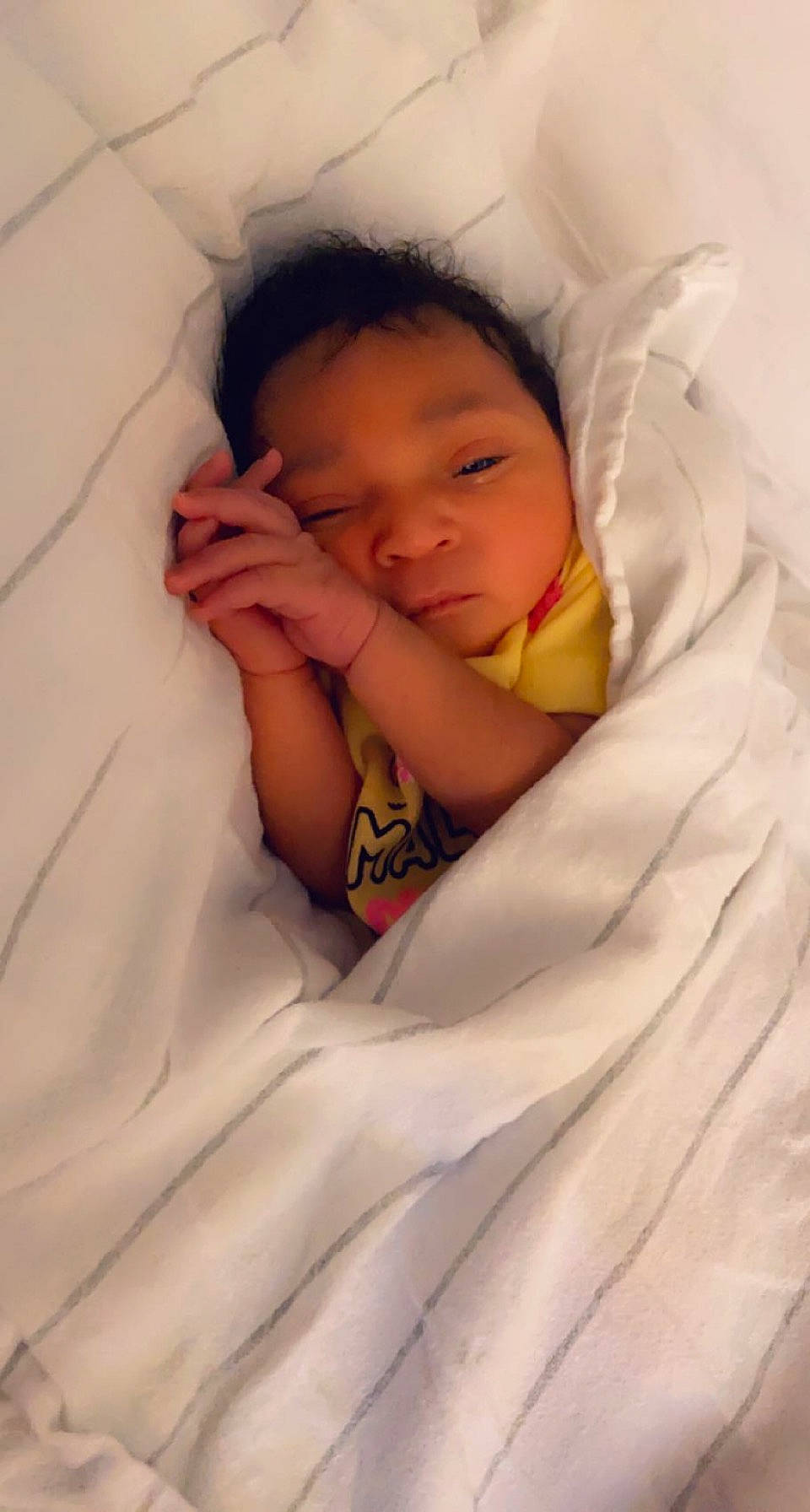 Dashonna is registered to the contest to win money with this photo: baby, baby_sleeping, baby_toddler_clothing, bed, cheek, child, comfort, eye, eyebrow, face, gesture, hair, happy, head, human_body, linens, nose, person, skin, thumb