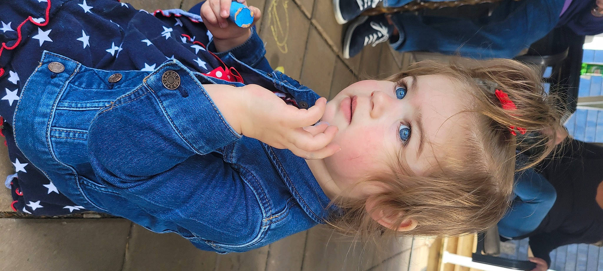 Mariella is registered to the contest to win money with this photo: child, clothing, cool, denim, elbow, electric_blue, eyelash, fun, gesture, human_leg, lip, mouth, nail, pattern, person, plaid, plant, skin, thigh, toddler
