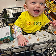 Dante joined the competition — help win amazing prizes! baby, child, shopping_cart, supermarket, smiling, yellow_shirt, grocery_store, happy, infant, clothing, person, aisle, retail, cute, retail_shelves, baby_in_cart, baby_clothing, shopping, store, toddler