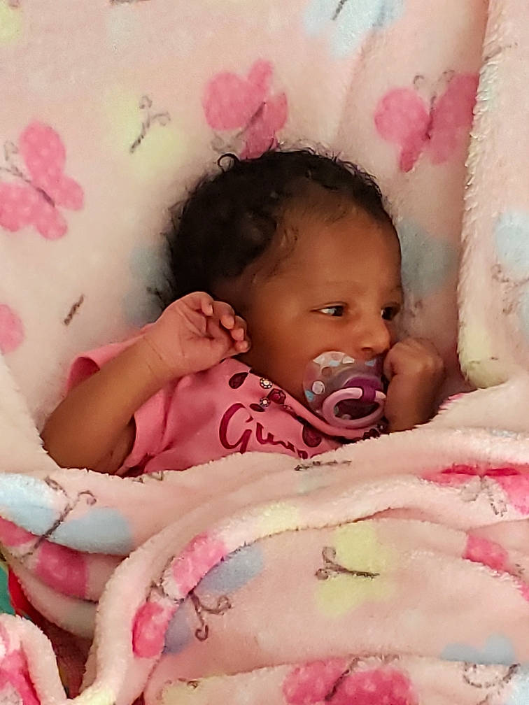 Aleynna is registered to the contest to win money with this photo: baby, baby_products, bedding, bedtime, birth, blanket, cheek, child, face, head, linens, lip, mouth, nose, person, pink, product, skin, textile, toddler
