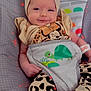 Symphanie is registered to the contest to win money with this photo: baby, infant, headband, bow, leopard_print, pants, smile, face, hand, foot, baby_chair, safety_harness, turtle, rainbow, sun, monkey, colorful, cute, indoors, happy