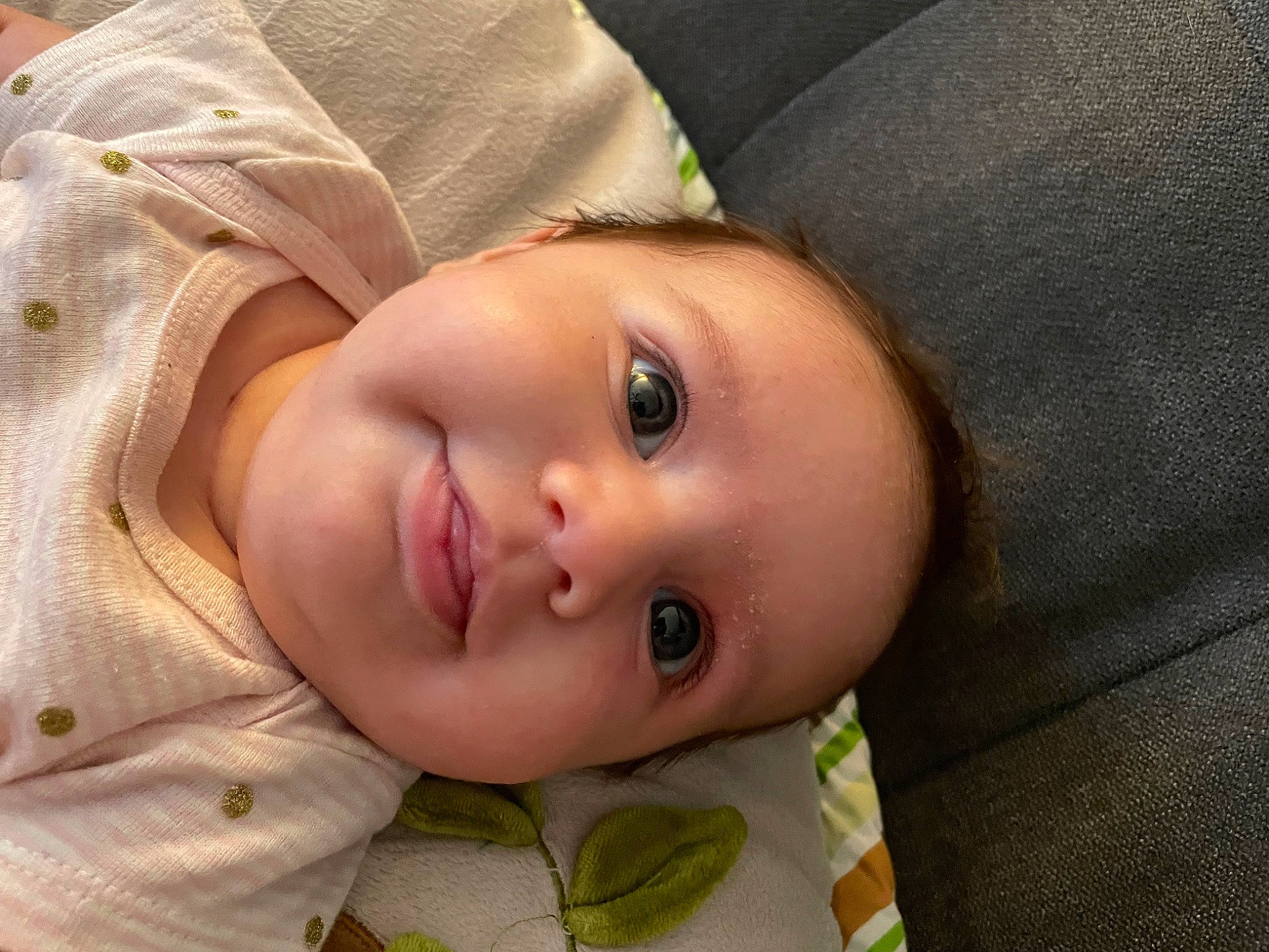 Ethel is registered to the contest to win money with this photo: baby, cheek, chin, eye, eyebrow, eyelash, forehead, hat, head, iris, lip, mouth, nose, outerwear, person, skin, sleeve, smile, textile, toddler