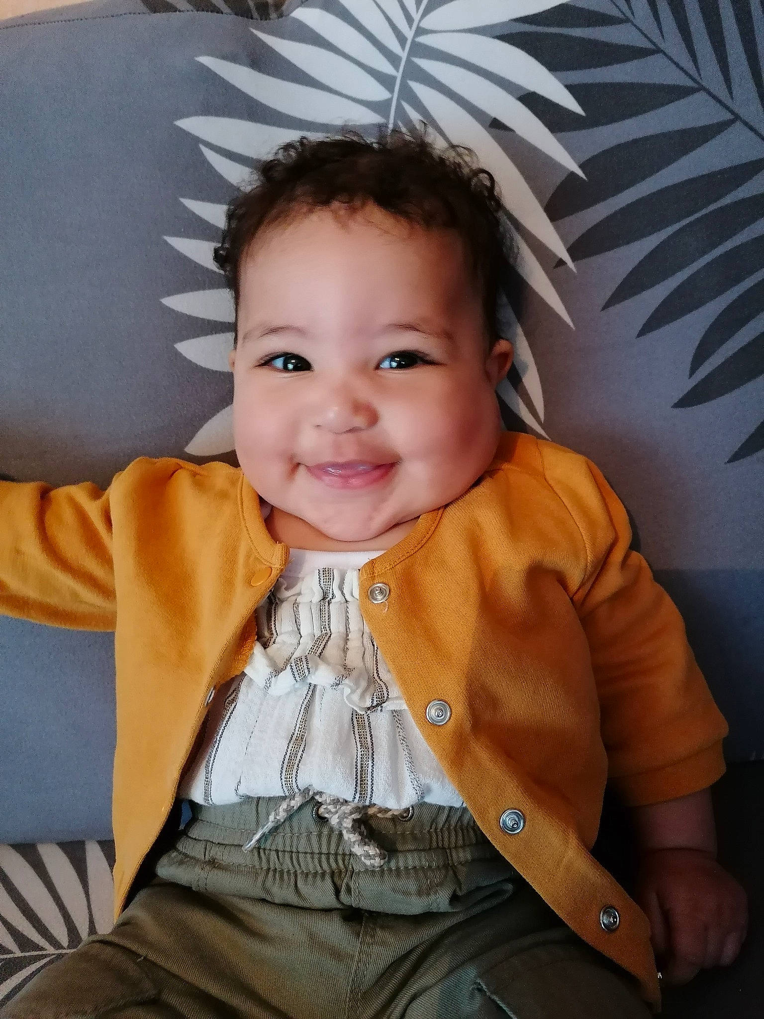 Aliyah participe au concours pour gagner de l'argent avec cette photo : baby, baby_products, baby_toddler_clothing, cheek, child, chin, eye, finger, fun, happy, iris, joy, neck, nose, outerwear, person, sitting, skin, sleeve, smile