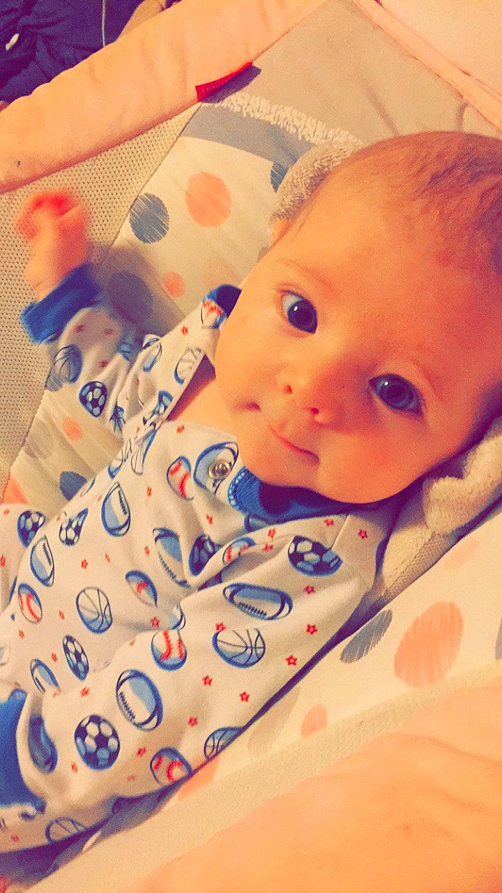 Nehemiah is registered to the contest to win money with this photo: bedtime, blue, cheek, child, day, eye, face, forehead, girl, head, infant, joy, lip, nose, organ, person, pink, product, skin, smile