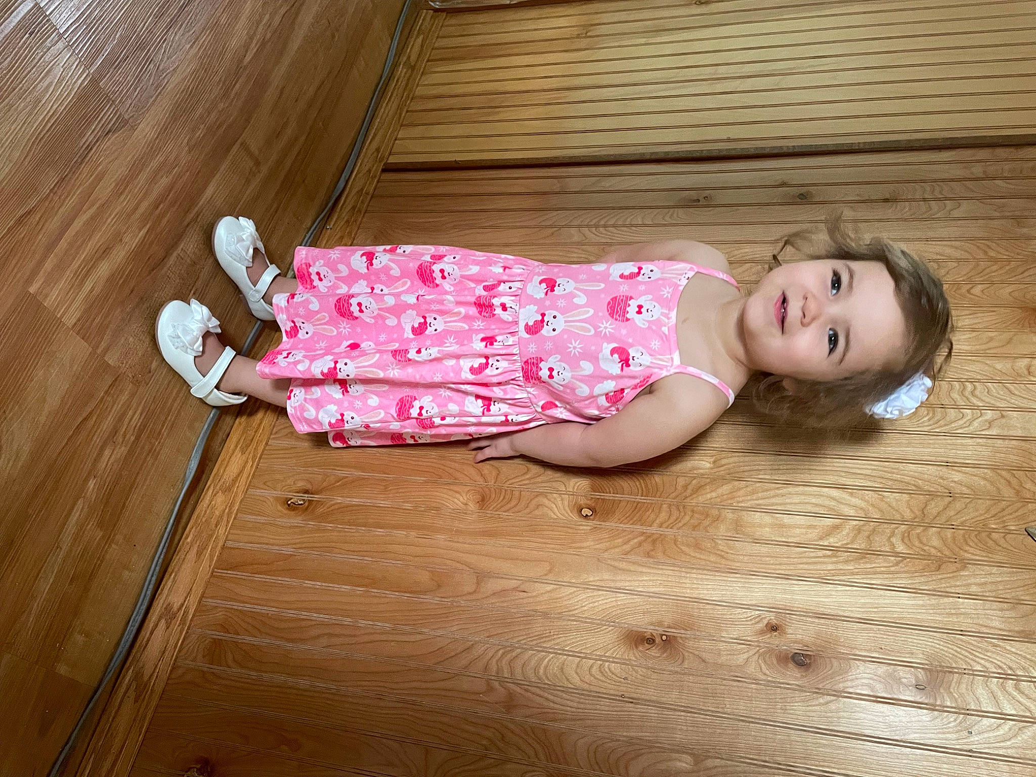 Julianna joined the competition — help win amazing prizes! baby_toddler_clothing, cheek, eye, face, floor, flooring, happy, hardwood, head, human_body, human_leg, joy, magenta, person, pink, sleeve, smile, sock, thigh, toddler